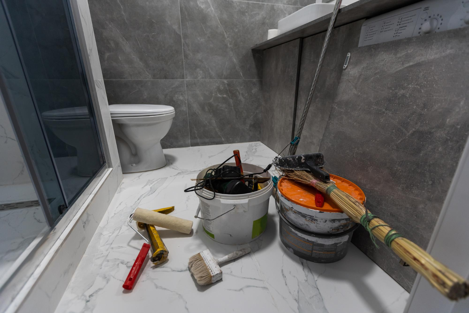 Bathroom renovation tools and flooring work in progress – Pro Dallas Bathroom