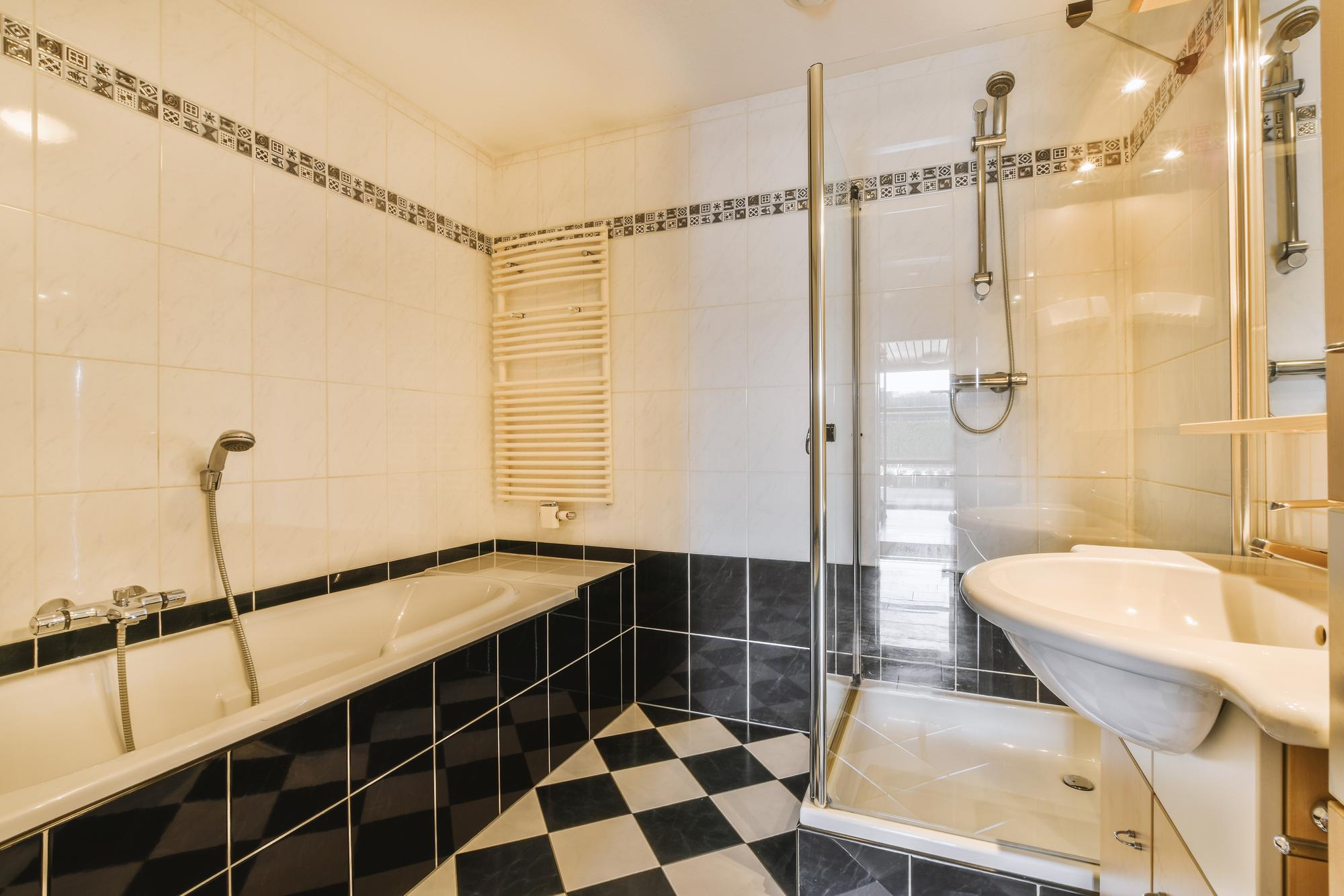 Bathroom with bathtub and glass shower installation – Pro Dallas Bathroom