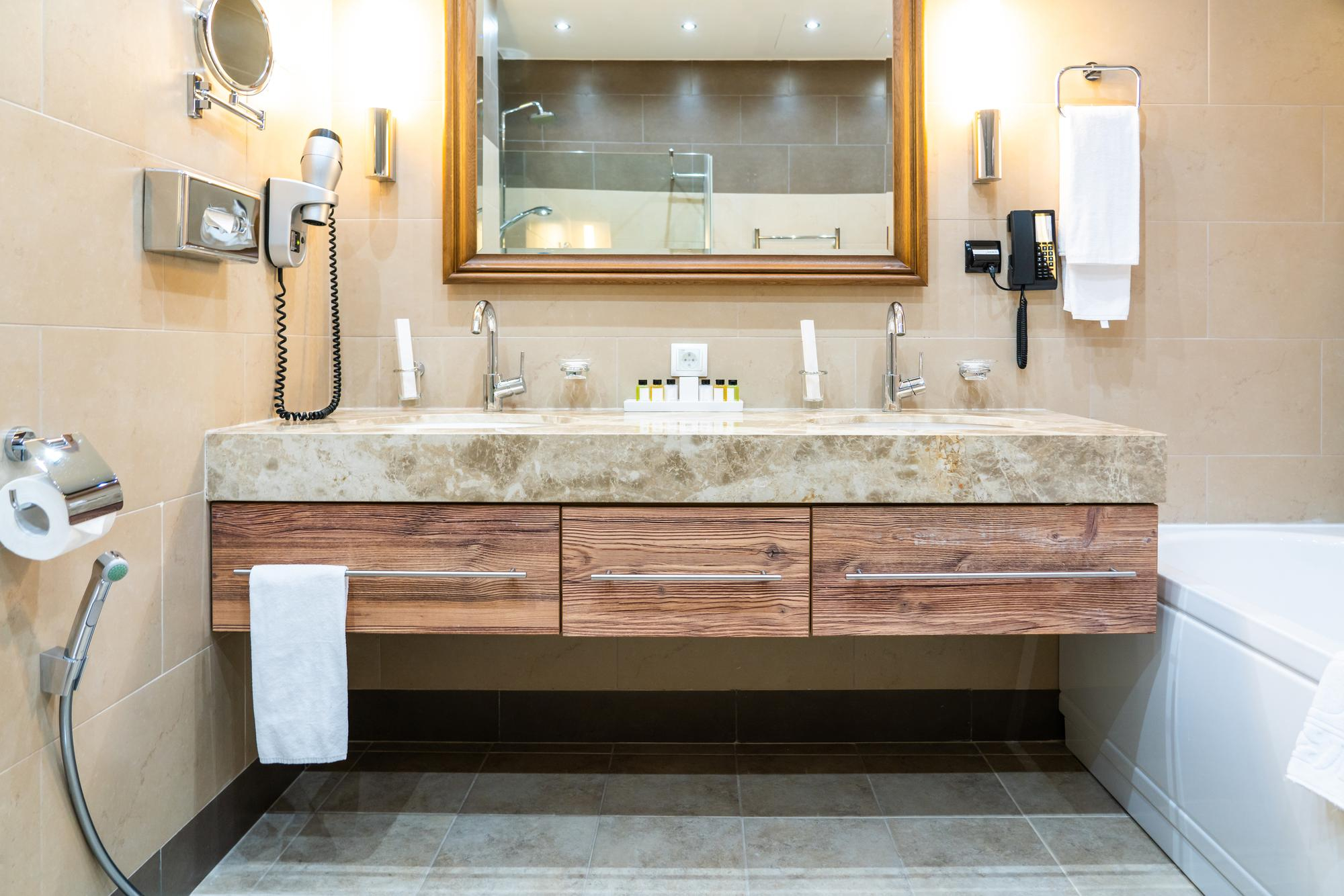Luxury bathroom vanity installation with stone countertop